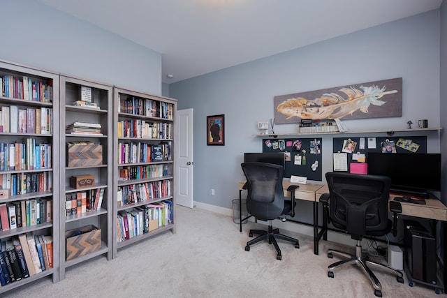 office space with carpet flooring and baseboards