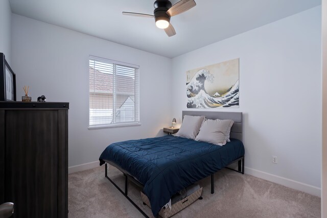 bedroom featuring a ceiling fan, carpet flooring, and baseboards