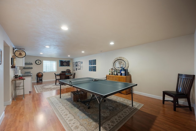 playroom featuring recessed lighting, baseboards, and light wood finished floors