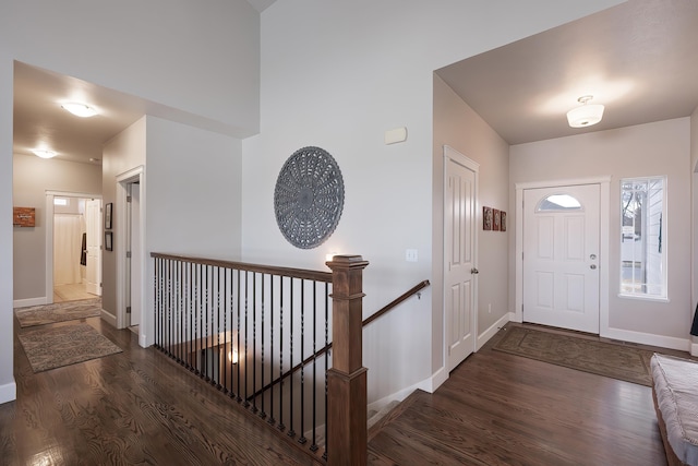 entrance foyer featuring wood finished floors and baseboards