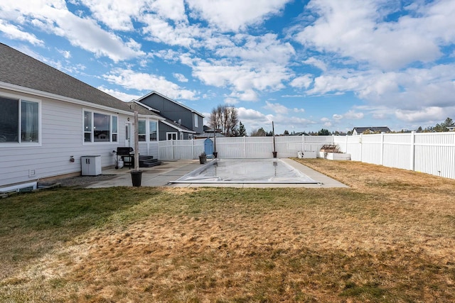 view of yard featuring a patio area and a fenced backyard