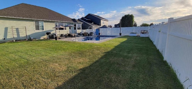 view of yard with a fenced in pool, a patio area, and a fenced backyard