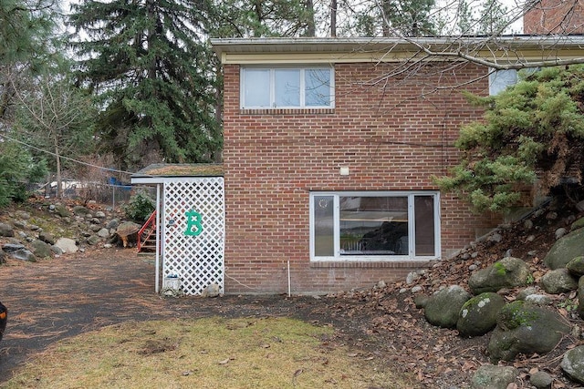 view of home's exterior featuring brick siding