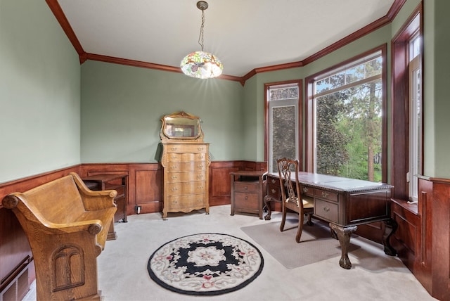 office space with light carpet, a wainscoted wall, and crown molding