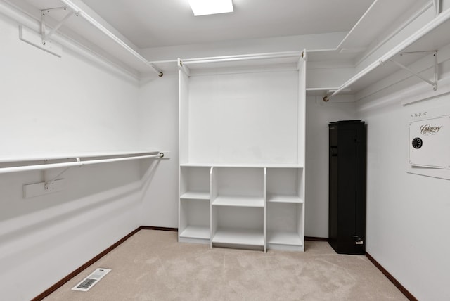 walk in closet featuring carpet floors and visible vents