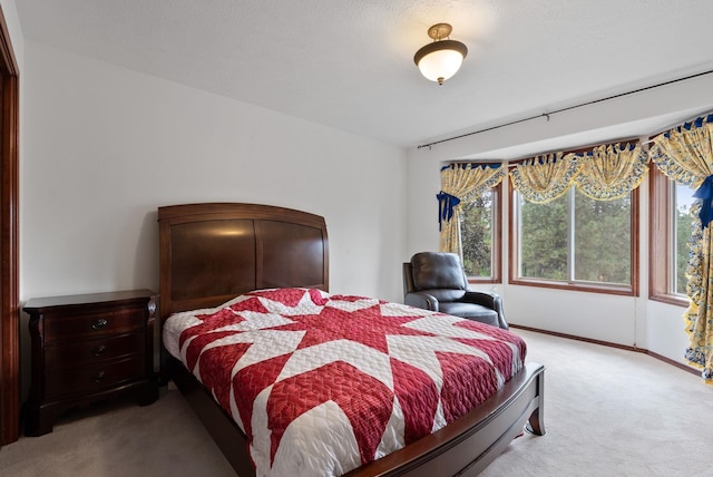 carpeted bedroom with baseboards