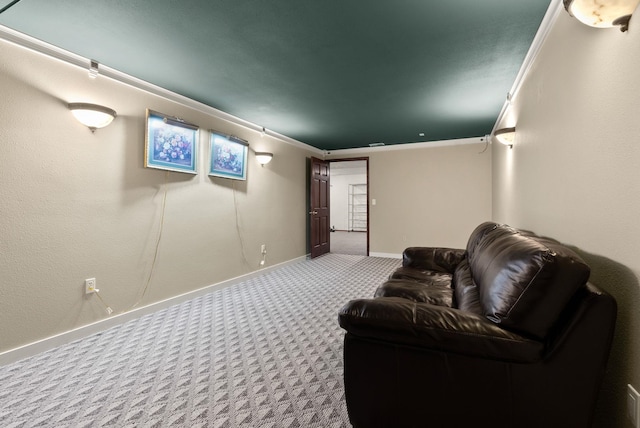 cinema room featuring carpet and baseboards