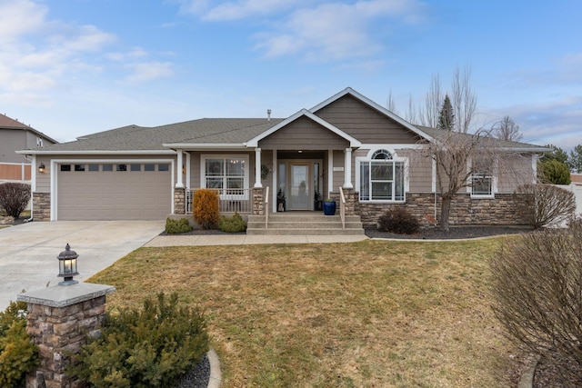 view of front facade featuring a garage, stone siding, and concrete driveway