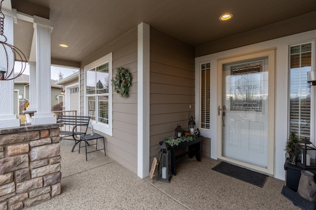 view of exterior entry featuring a porch