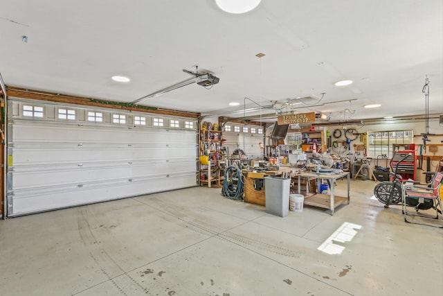 garage featuring a workshop area and a garage door opener