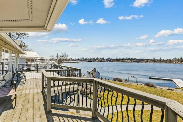 wooden deck with a water view