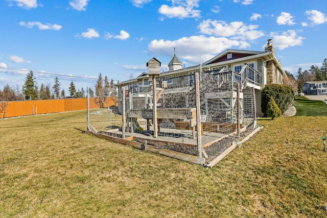 view of outdoor structure featuring fence