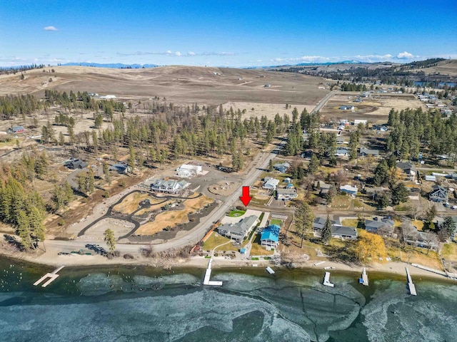 birds eye view of property with a mountain view