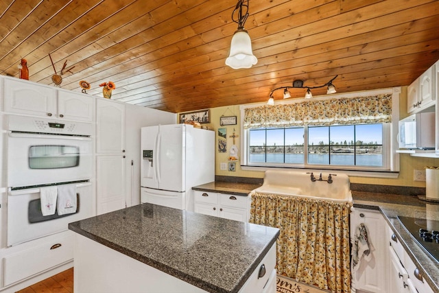 kitchen featuring hanging light fixtures, white appliances, wood ceiling, and white cabinets