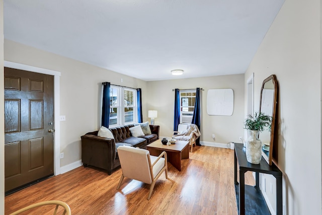 living room with light wood-style floors and baseboards