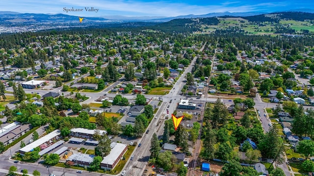 birds eye view of property featuring a mountain view