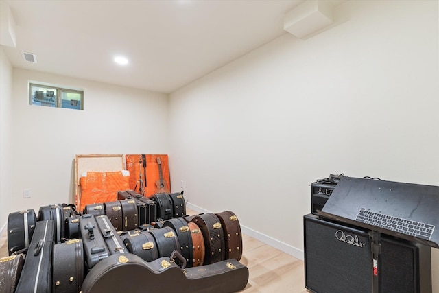 miscellaneous room featuring recessed lighting, visible vents, baseboards, and wood finished floors