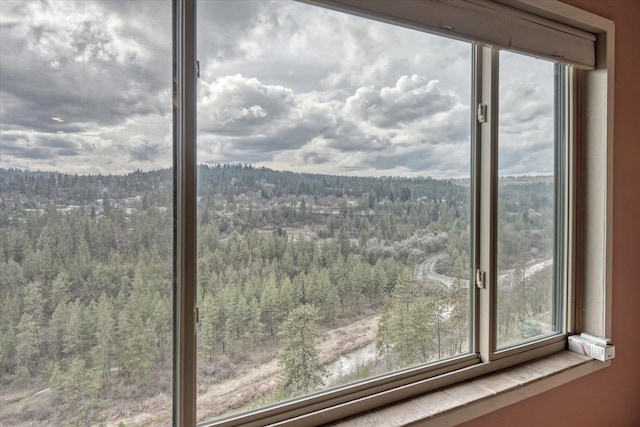 property view of mountains featuring a forest view