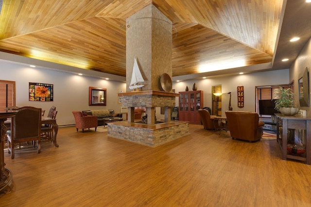 living area featuring wooden ceiling, a fireplace, high vaulted ceiling, and wood finished floors