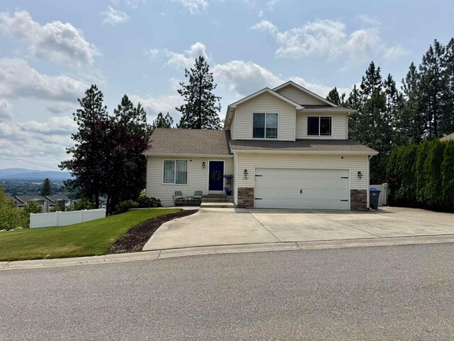 5507 N Colton Ln, Spokane, WA 99212 - traditional home with a garage and concrete driveway