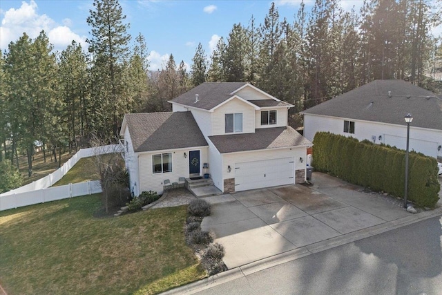 traditional-style home featuring an attached garage, fence, stone siding, driveway, and a front lawn