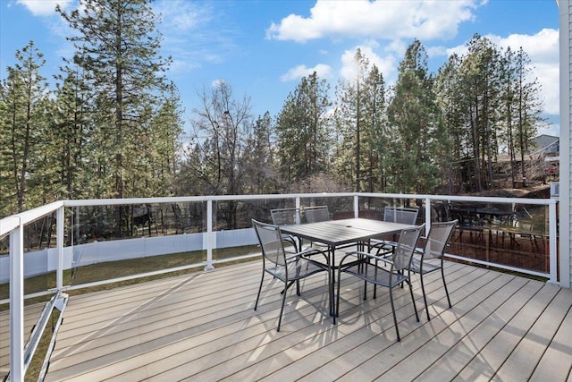 wooden deck with outdoor dining area