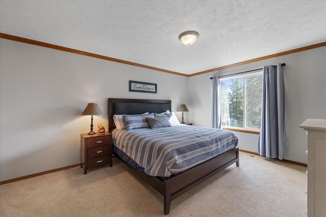 bedroom with baseboards, ornamental molding, a textured ceiling, and light colored carpet