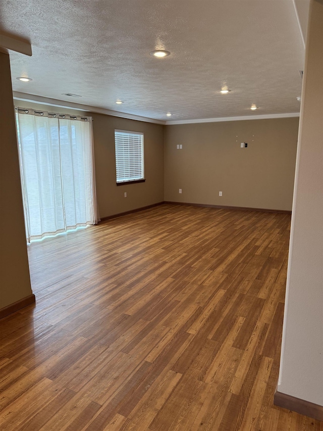 5507 N Colton Ln, Spokane, WA 99212 - empty room with ornamental molding, wood finished floors, recessed lighting, and a textured ceiling