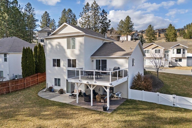 5507 N Colton Ln, Spokane, WA 99212 - rear view of property with a residential view, a fenced backyard, a patio area, and a deck