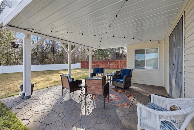 view of patio with a fenced backyard and an outdoor living space