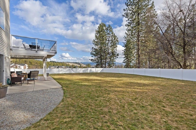 view of yard featuring a patio area and fence