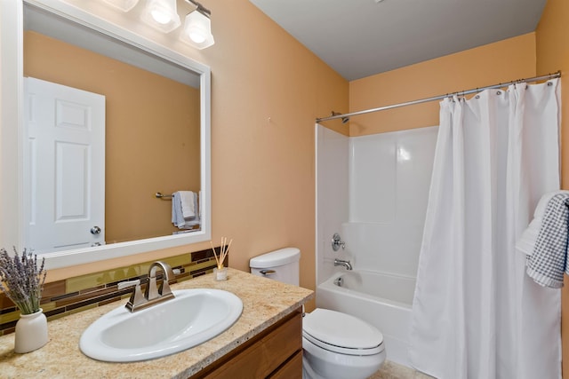 full bath with shower / bath combo, vanity, and toilet