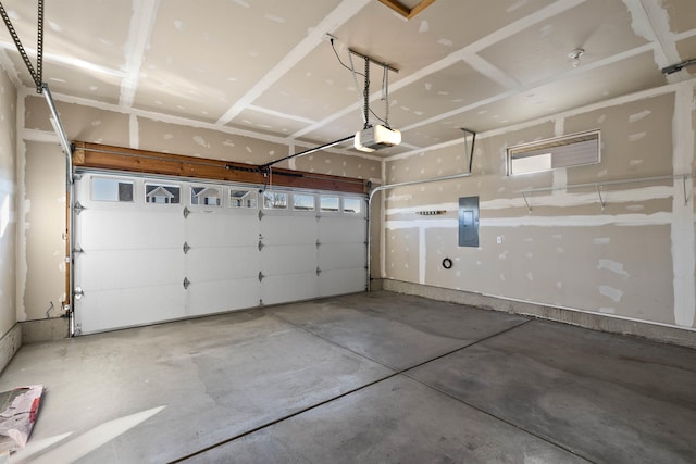 garage with electric panel and a garage door opener