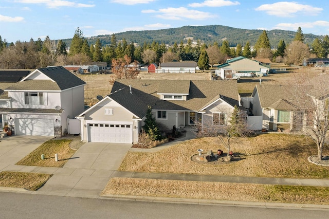 drone / aerial view with a residential view and a mountain view