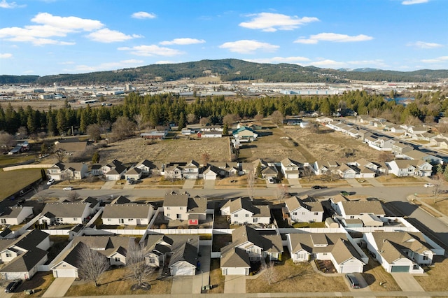 drone / aerial view featuring a residential view and a mountain view