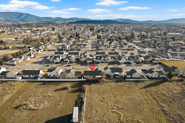 drone / aerial view featuring a residential view and a mountain view