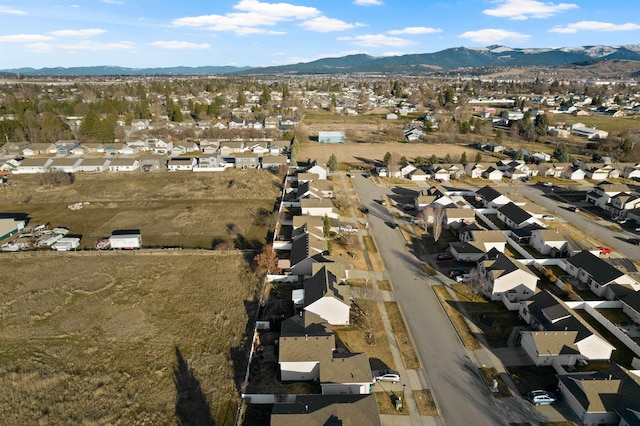 drone / aerial view with a residential view and a mountain view