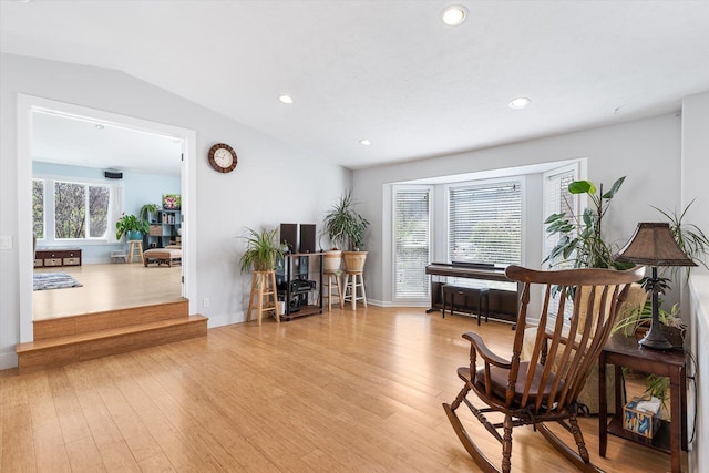 sitting room with recessed lighting, lofted ceiling, and wood finished floors