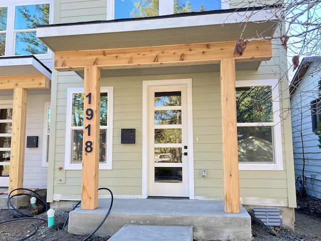 property entrance featuring covered porch