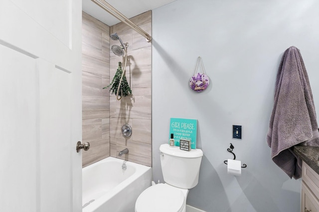 bathroom featuring toilet, vanity, and shower / bathtub combination