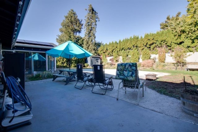 view of patio with an outdoor fire pit