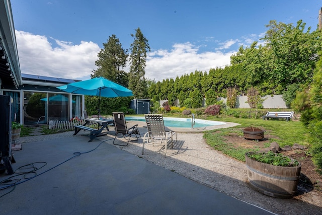 6514 N Sutherlin St, Spokane, WA 99208 - view of swimming pool featuring an outdoor fire pit and a patio
