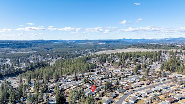 bird's eye view with a forest view, a residential view, and a mountain view