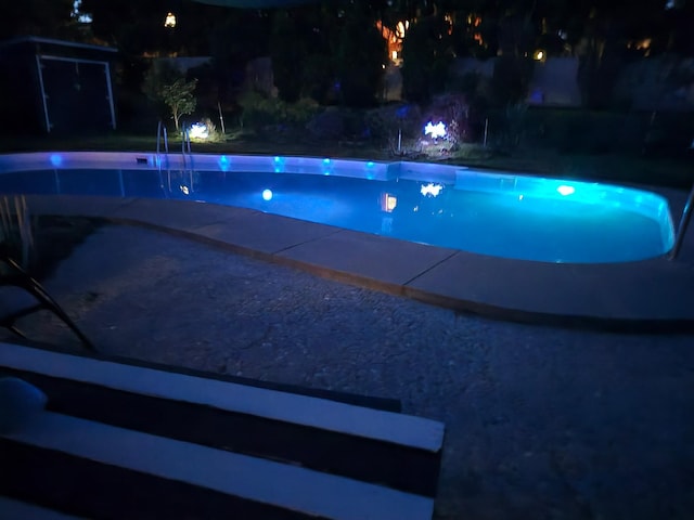 6514 N Sutherlin St, Spokane, WA 99208 - pool at night with an outdoor pool
