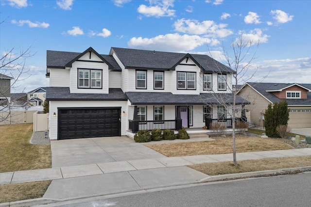 view of front of house with covered porch, a garage, fence, driveway, and roof with shingles