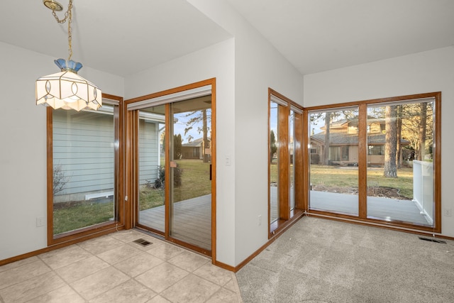 doorway to outside featuring visible vents and baseboards