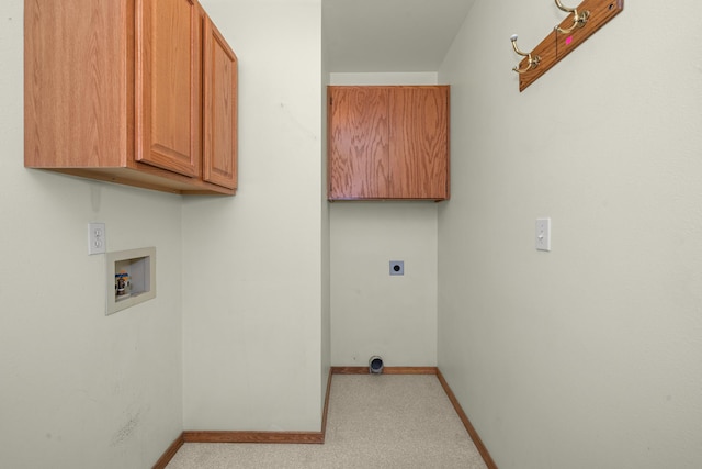 washroom with washer hookup, cabinet space, hookup for an electric dryer, and baseboards