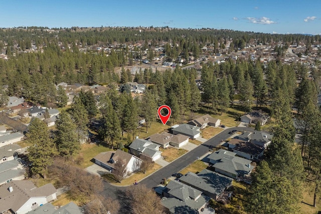 bird's eye view with a residential view and a view of trees