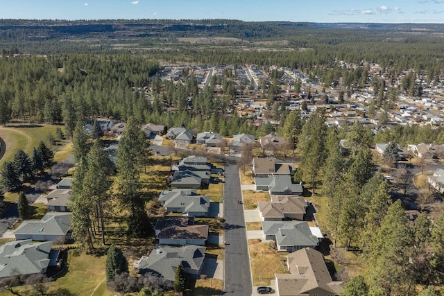 aerial view with a residential view and a view of trees