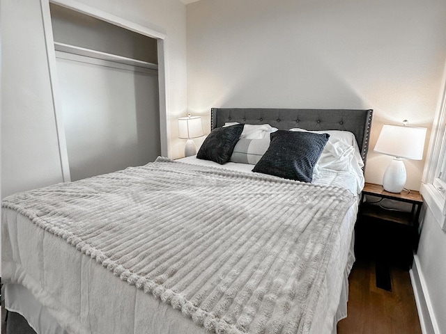 bedroom with a closet and wood finished floors